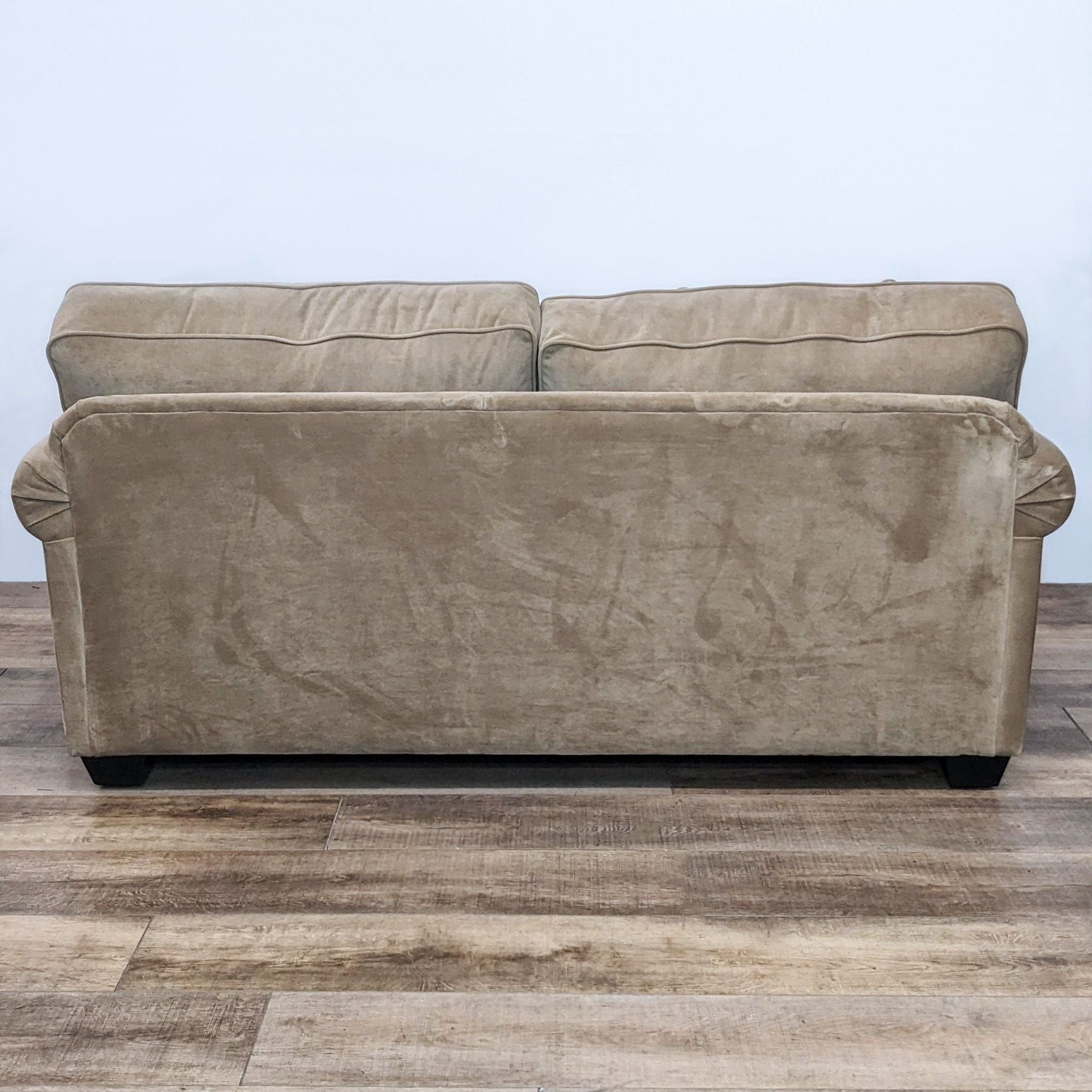 Reperch contemporary classic 3-seat sofa with narrow rolled arms, T back cushions, and dark finish feet on a wood floor.