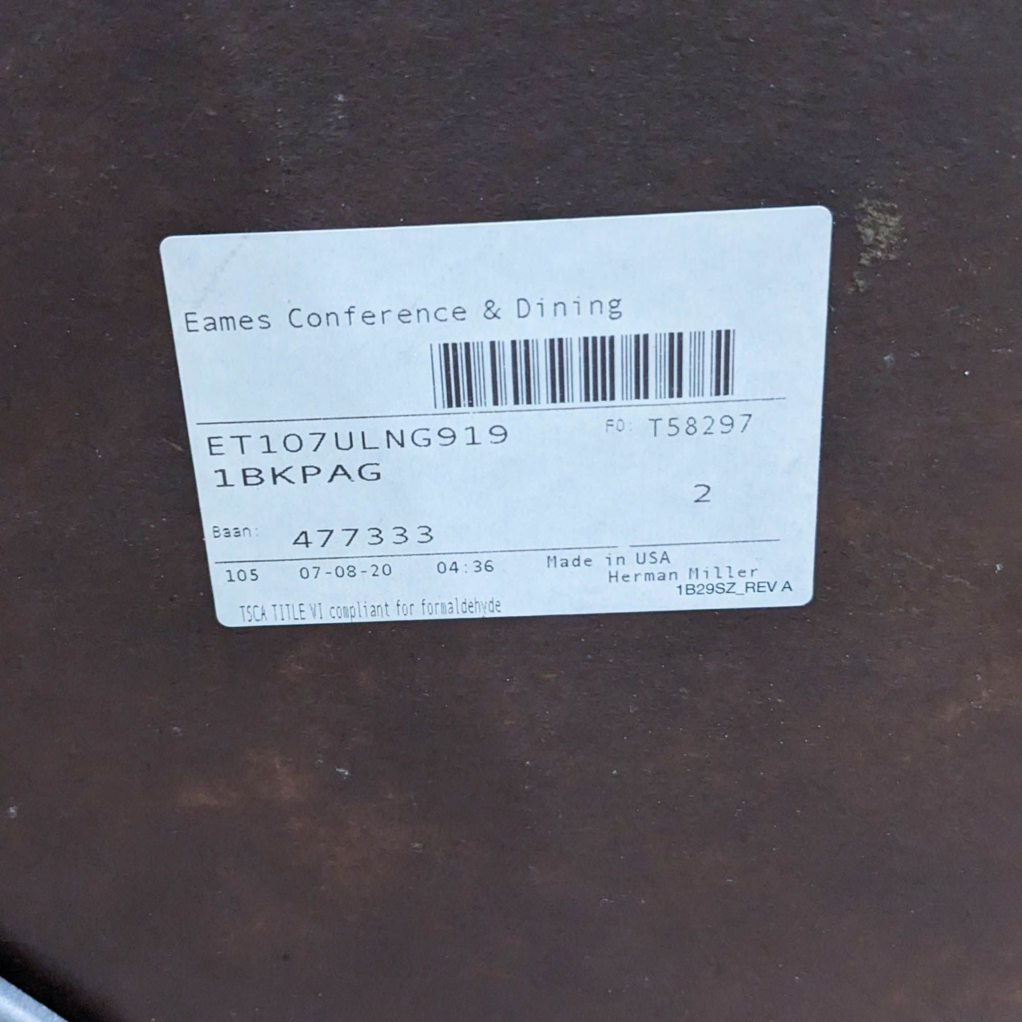 Label on a Herman Miller Eames dining table showing product details.