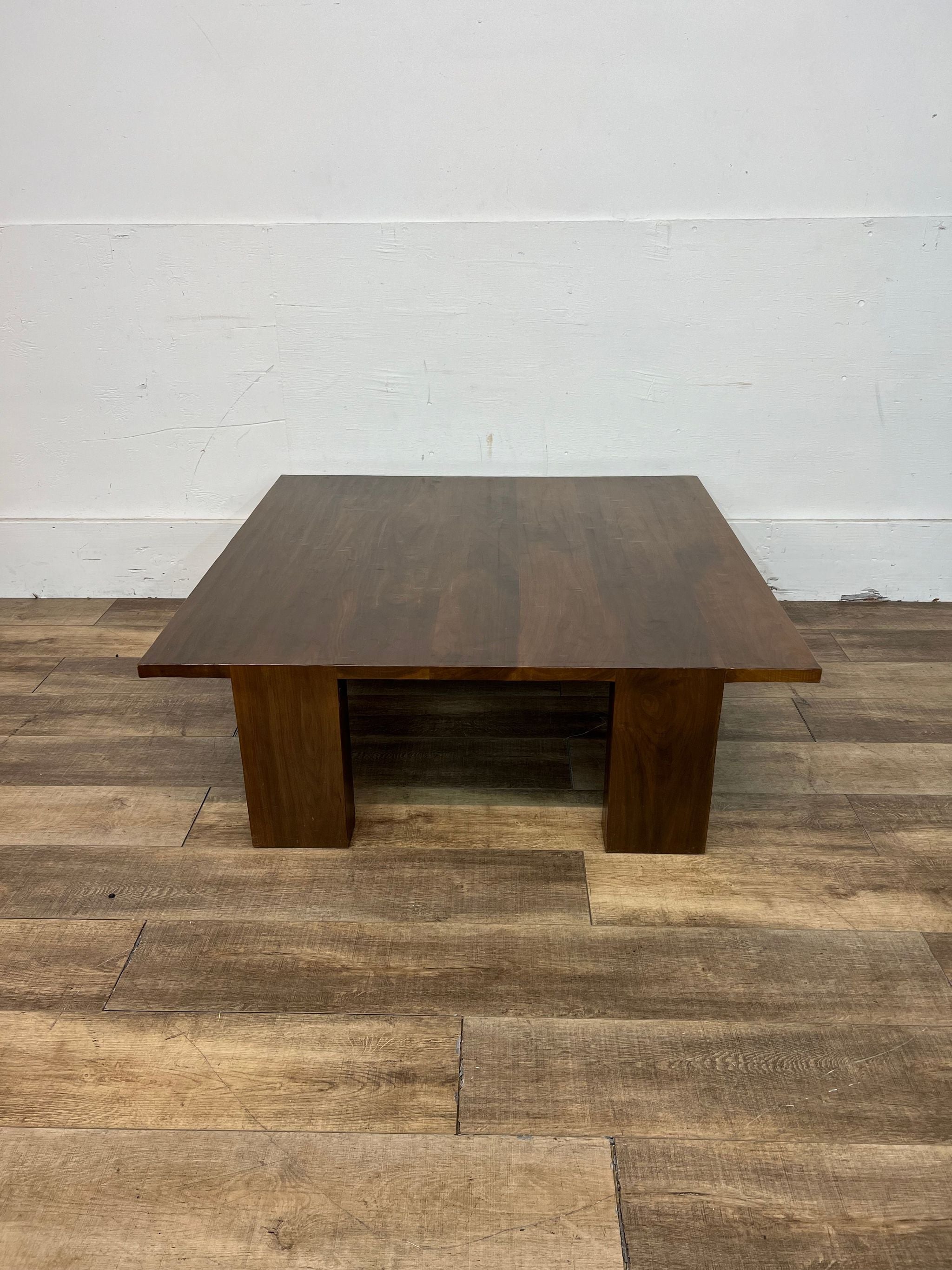Kendall Wilkinson Design Workshop's bespoke walnut coffee table, shown head-on.