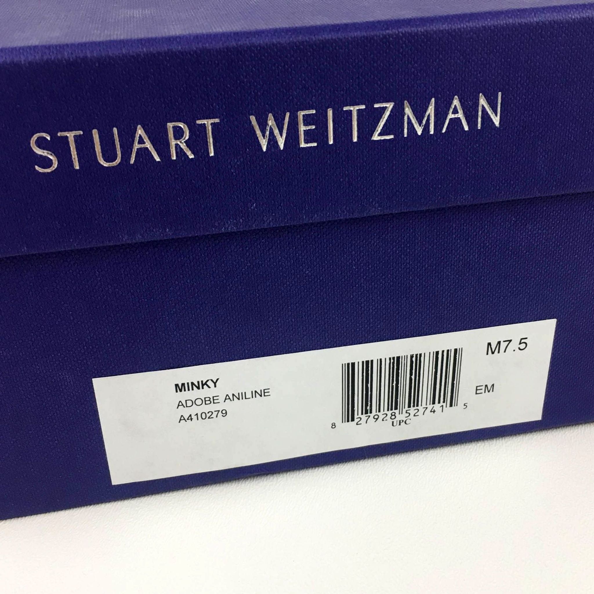 2. Close-up of a Stuart Weitzman shoe box label indicating model Minky, color Adobe Aniline, size 7.5.