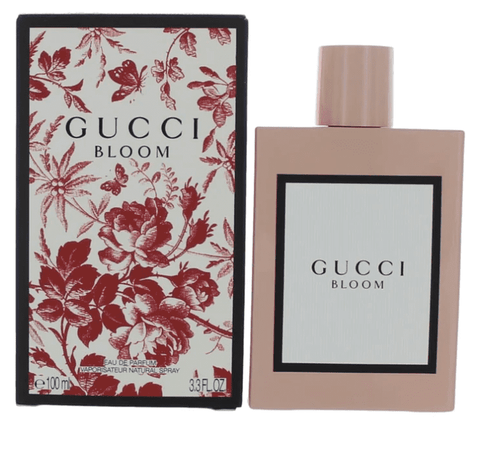 3.3 oz. bottle of gucci bloom perfume along with pink rosy packaging