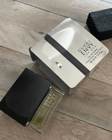 photo of a bottle of gucci envy cologne