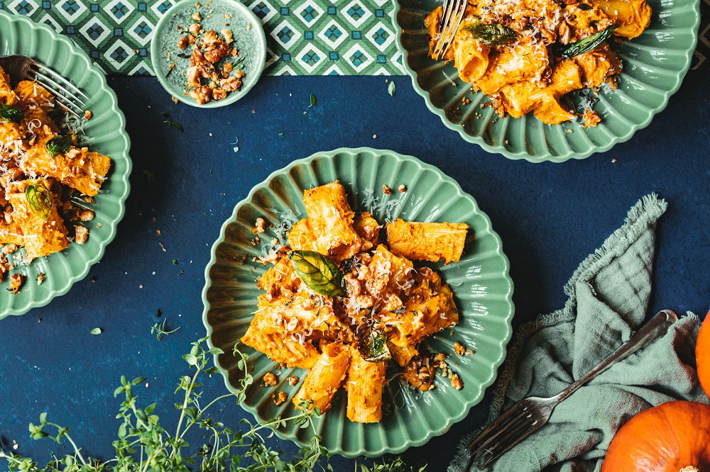 Creamy pumpkin rigatoni on a plate.