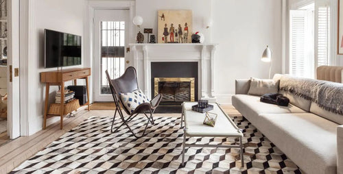 living-room-rug-ideas-laurie-blumenfeld-1637173326.jpg__PID:4c721ec7-171a-408c-bc0c-2915963f3ef3