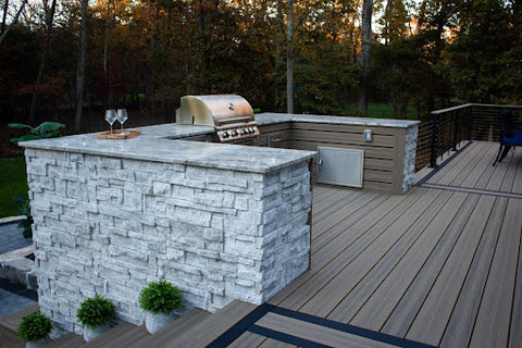 Outdoor living space with outdoor kitchen on deck with grill