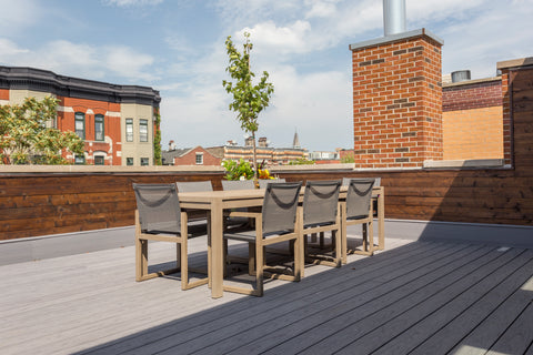 Deckorators Vault Decking in Dusk with brick siding on rooftop