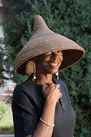 African American Woman wearing Tutsi Tight Weave Hat