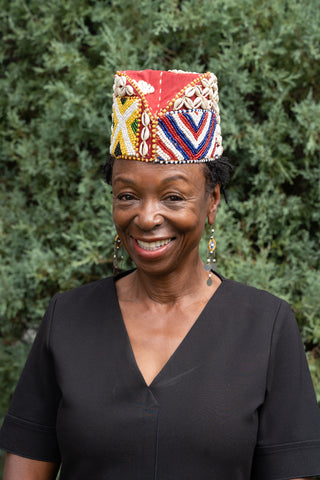 African American woman wearing Kuba Beaded Noble's Hat