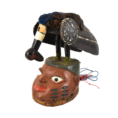 Yoruba Gelede mask with black bird.