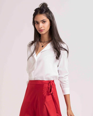 girl wearing white top and red skirt