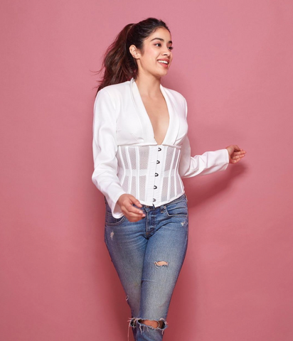 Kapoor wearing white top with bustier