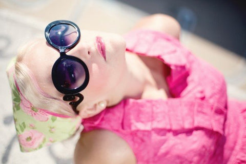 sunbathing with sunglasses on