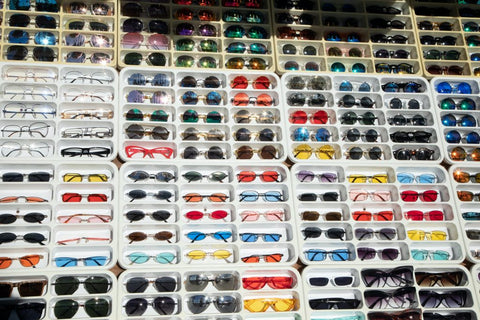 a large array of sunglasses on display