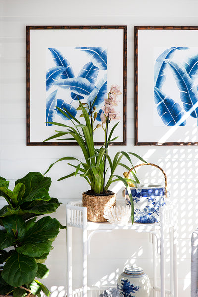 Hampton style house with blue banana palm leaf wall art prints by Kerri Shipp Driftwood Interiors