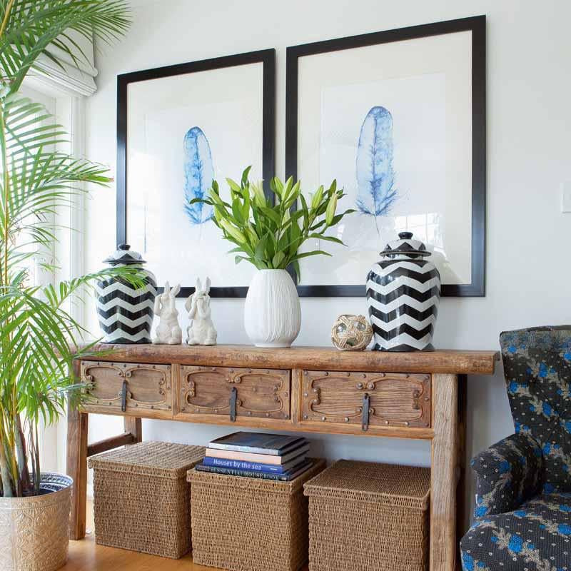 blue feather prints over timber console kerri shipp driftwood Interiors