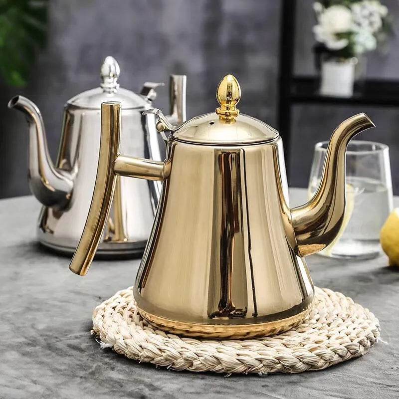 Golden silver teapot with infuser