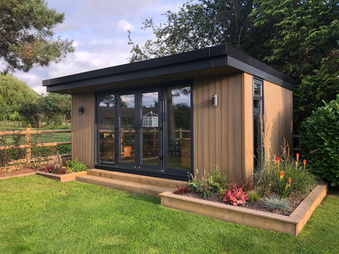 A garden room with a front canopy and composite cladding in Shrewsbury