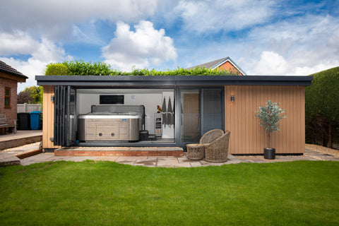 A garden room in Chester, Cheshire with a hot tub and sliding aluminium doors
