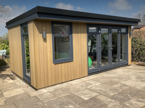 A small garden office with a gym attached