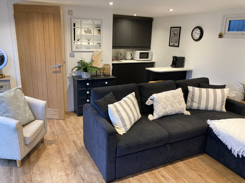 Interior of a garden office with settee and to focal point