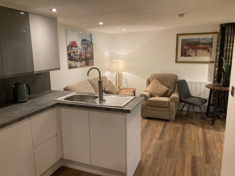 A living room and kitchen in a granny annexe