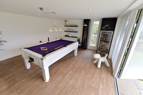 A pool table in a contemporary garden room in Manchester