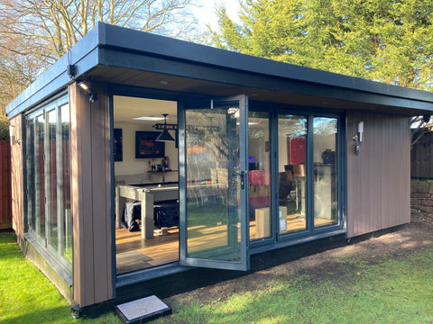 A garden room office in Wirral with a pool table and drinks bar
