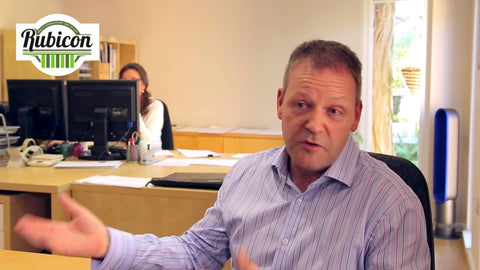 A video of man sitting at a desk and talking in a garden office on the Wirral, Cheshire.