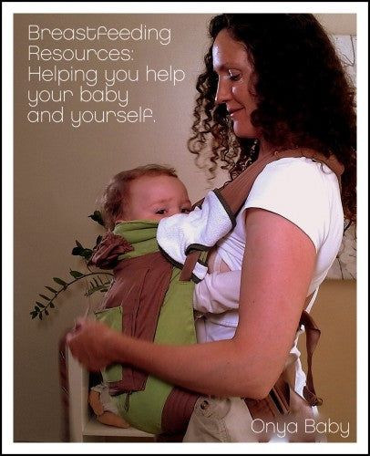 Mother breastfeeding in a baby carrier