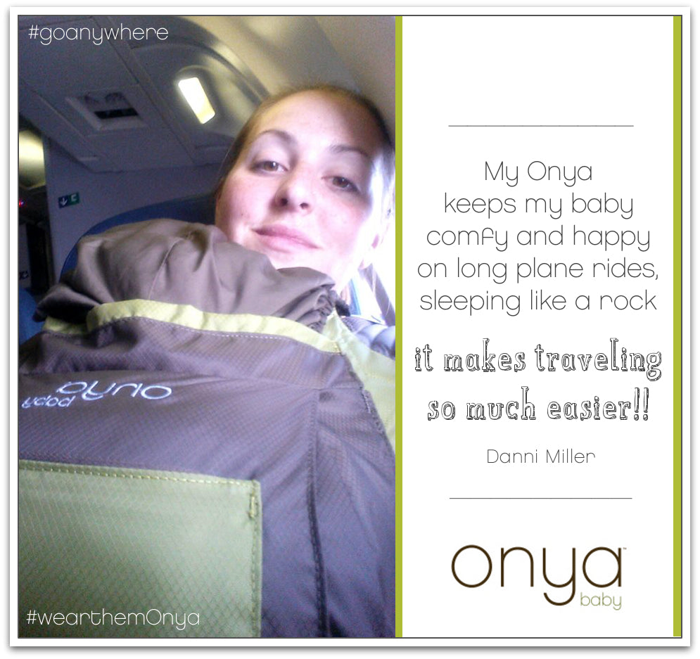 Mother with child in Onya Baby carrier on a plane