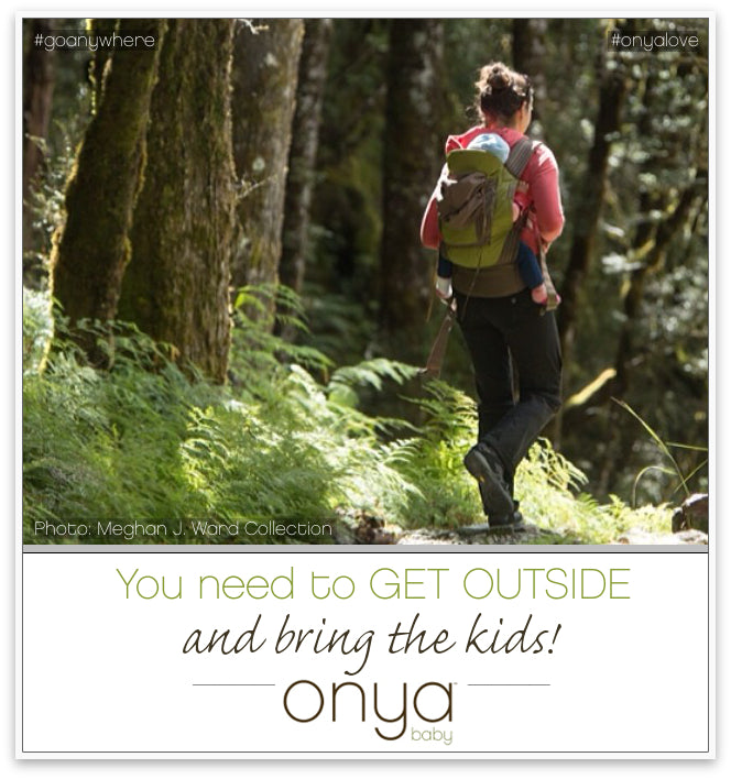 Parent hiking outside with baby on back in Onya Baby Carrier