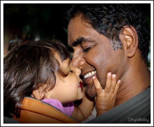 Father smiling and laughing with daughter