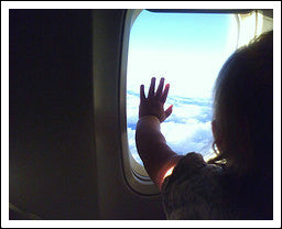 Child traveling with parents in plane