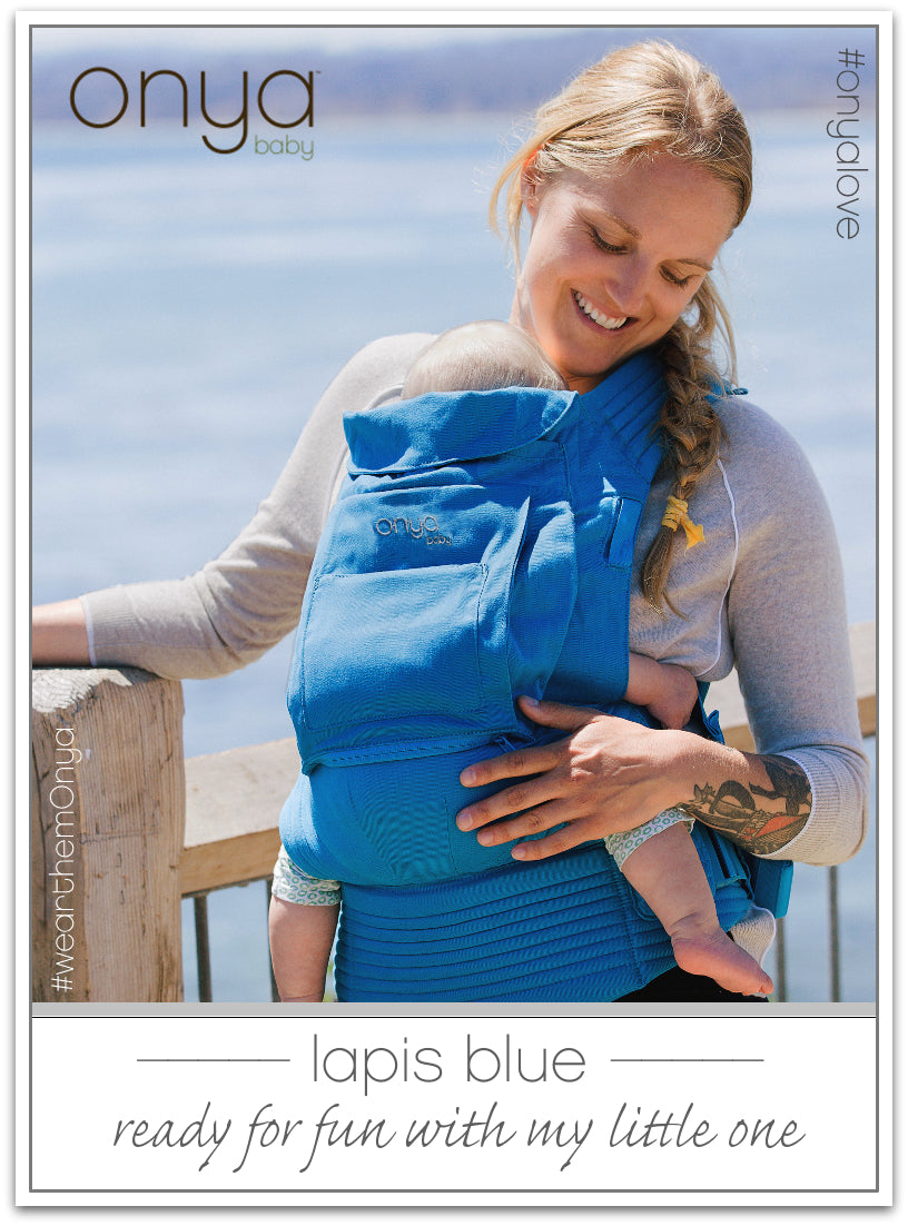 Woman carrying baby in Lapis Blue Onya Baby Cruiser
