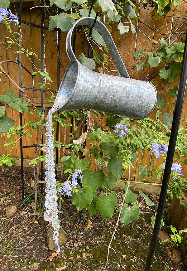 Pouring Crystals Watering Pitcher Garden Art