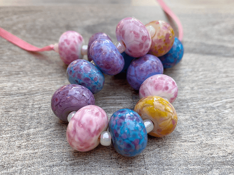 https://www.swcreations.net/collections/lampwork-beads/products/handmade-candy-pink-lampwork-beads-set-sra
