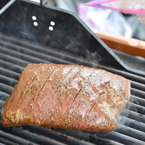 Flank steak on a barbecue