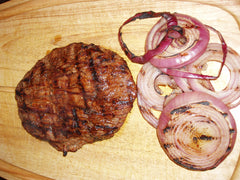 Remove steak and onions from grill.