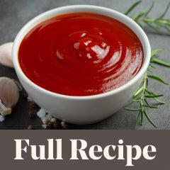 close up photo of tomato ketchup in a small bowl