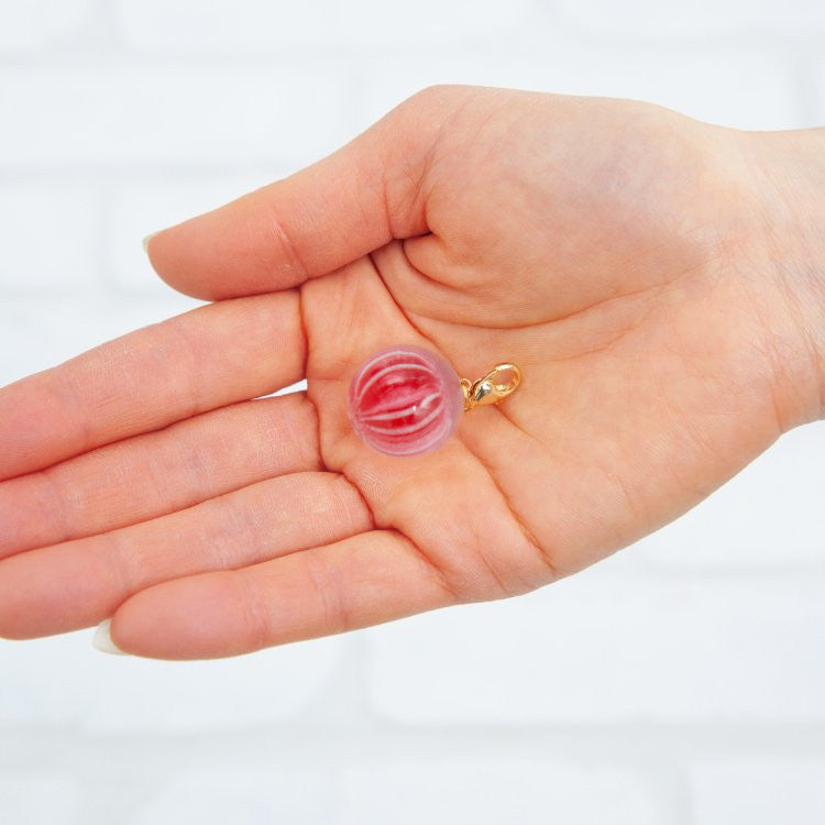 This is a transparent red charm.