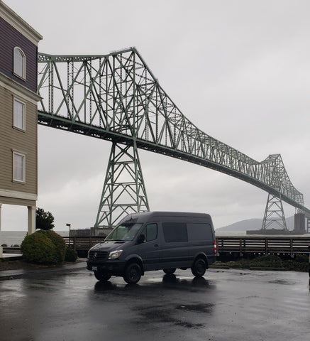 Sprinter van with Astoria bridge Oregon