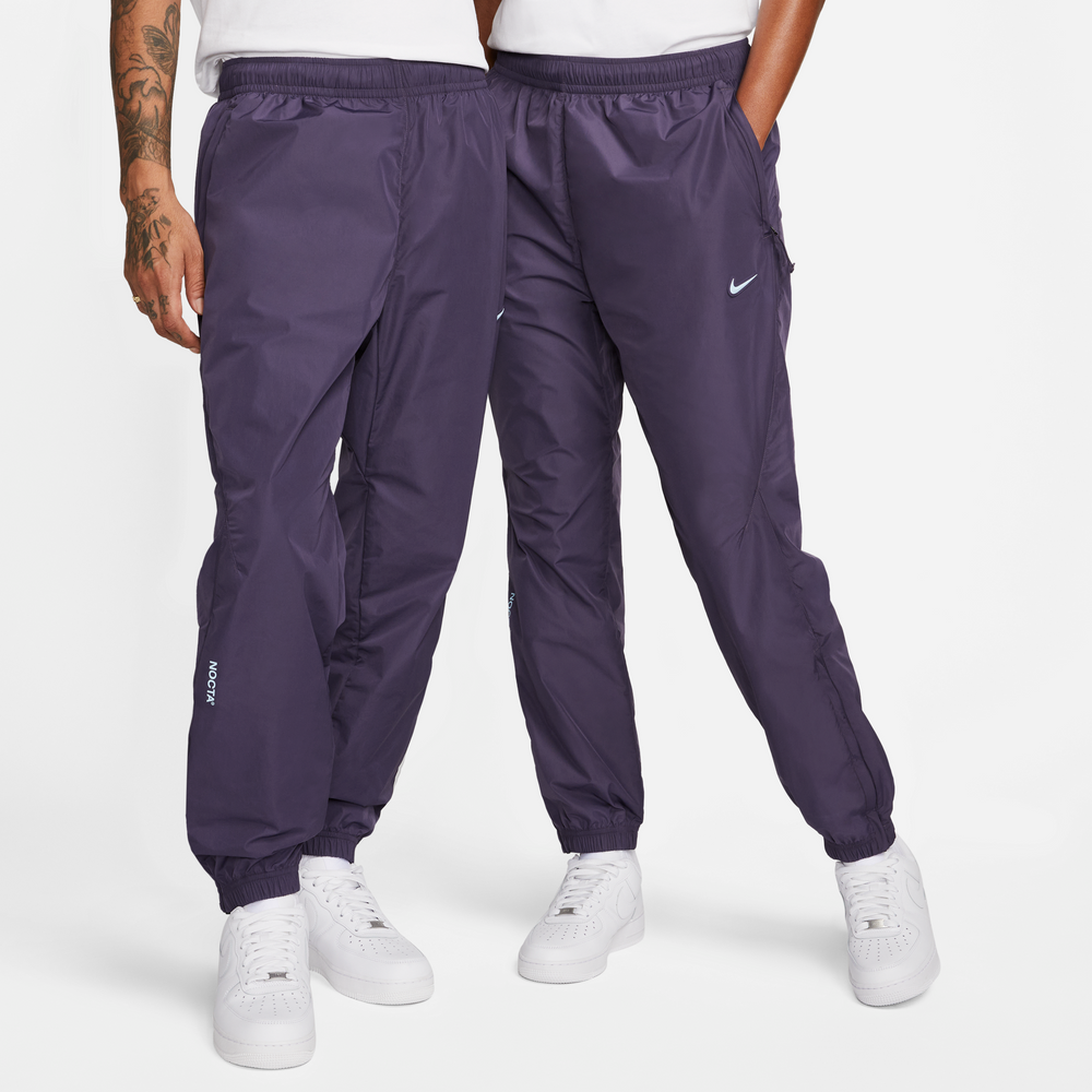 Nike NOCTA Nylon Track Pants In Dark Raisin