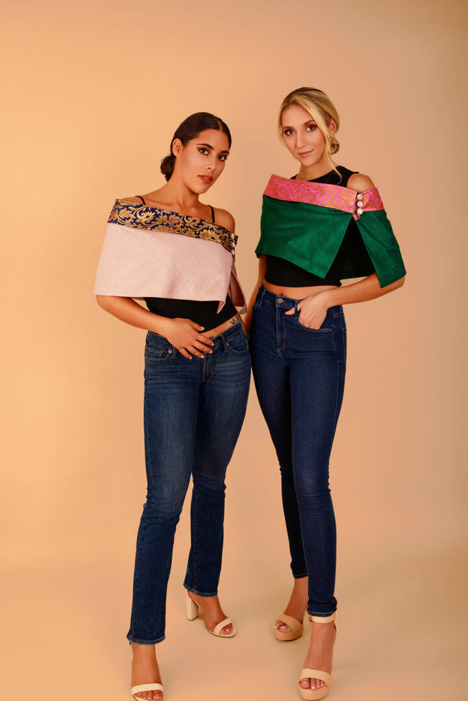 two models in dark jeans and Indian-inspired shawls