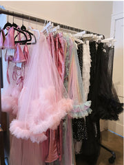 Clothing Rack with Sequin Tops and Tulle Robes
