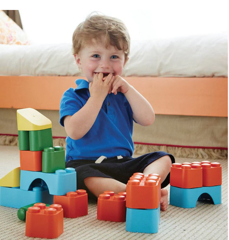 Toddler Playing with Green Toys Blocks