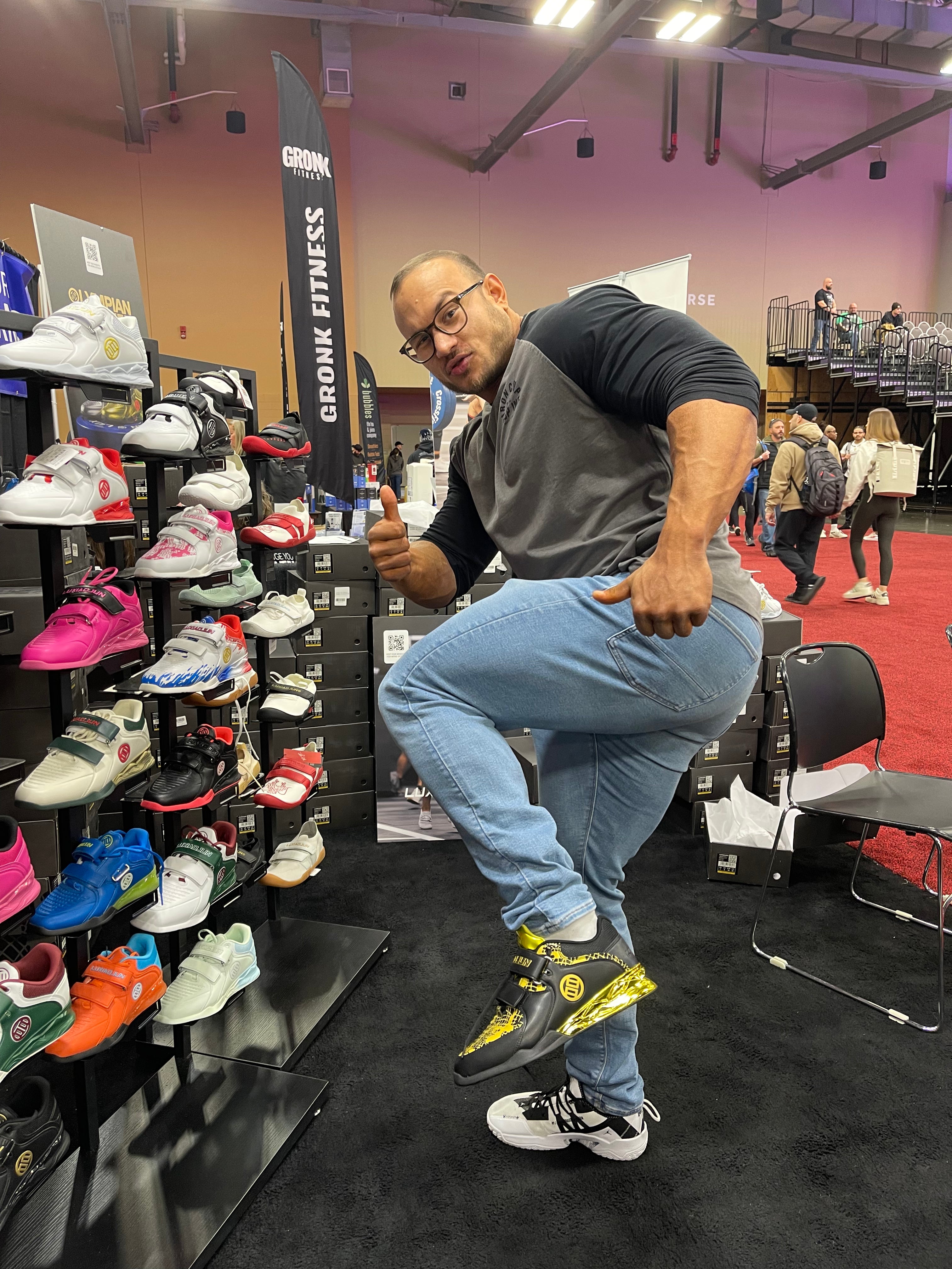 Lucas Funk trying on the LUXIAOJUN limited edition snake year black and gold weightlifting shoes.