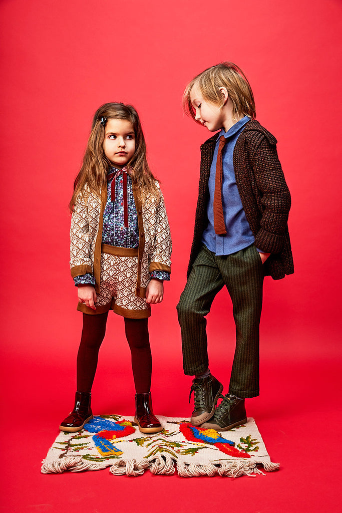 boy and girls in paade mode garments