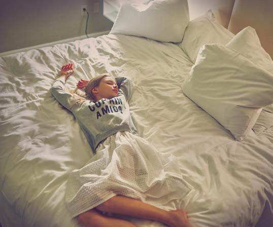 girl lying in the bed in paade mode skirts