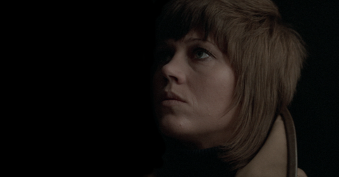 Close up of Jane Fonda's face with a completely dark background from the film Klute