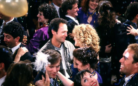 Movie Still from When Harry Met Sally, featuring Billy Crystal and Meg Ryan dancing during a New Years Eve Party.